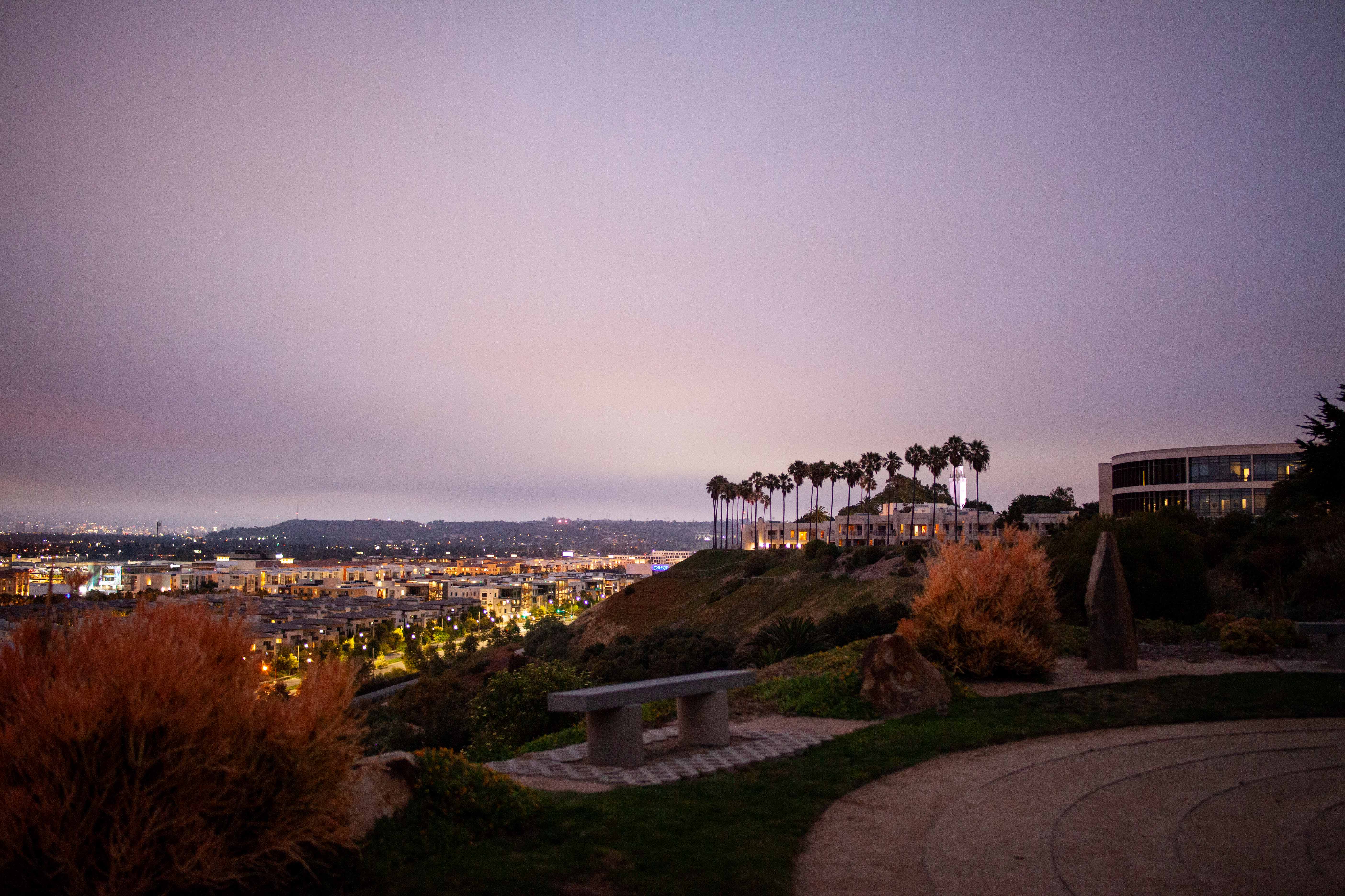 Photo of the LMU bluff view at dusk overlooking the library and Playa Vista neighborhood.